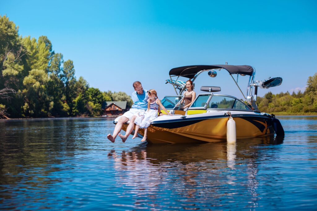 people sitting on ski boat in the lake